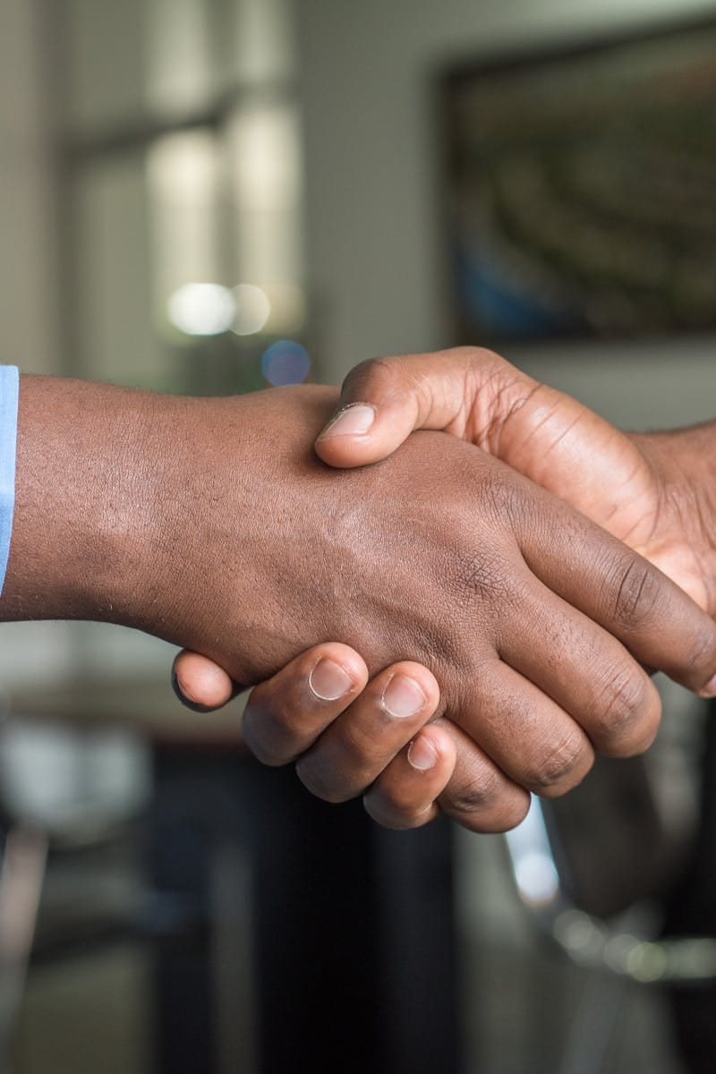 About us 5 Two Person in Long-sleeved Shirt Shakehand